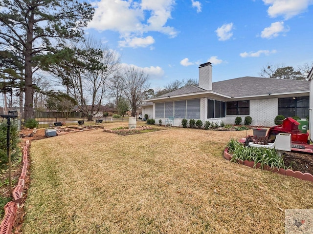 view of yard with a sunroom