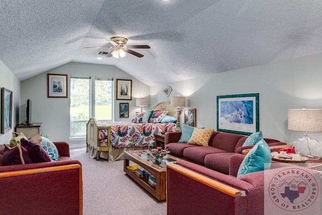 bedroom featuring ceiling fan, carpet flooring, a textured ceiling, and lofted ceiling