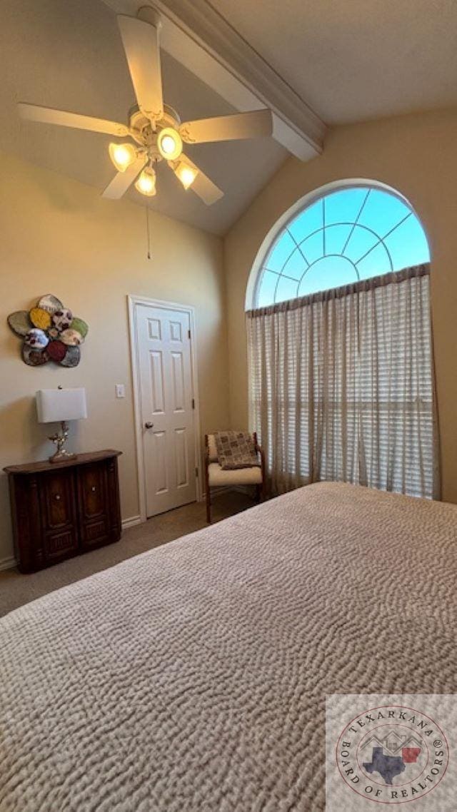 carpeted bedroom featuring ceiling fan and vaulted ceiling with beams