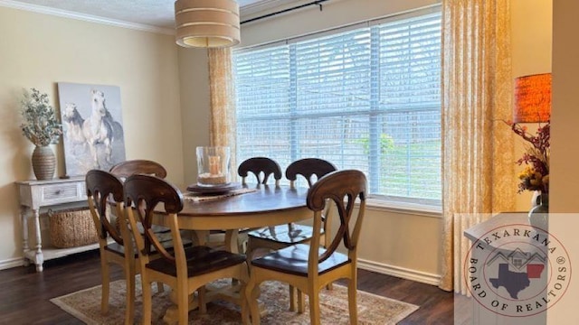 dining area featuring crown molding and dark hardwood / wood-style floors