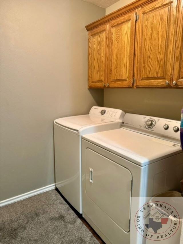 laundry area with cabinets, dark carpet, and independent washer and dryer