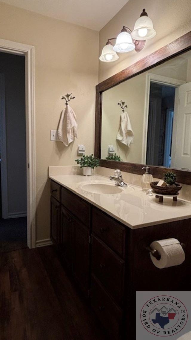 bathroom featuring wood-type flooring and vanity