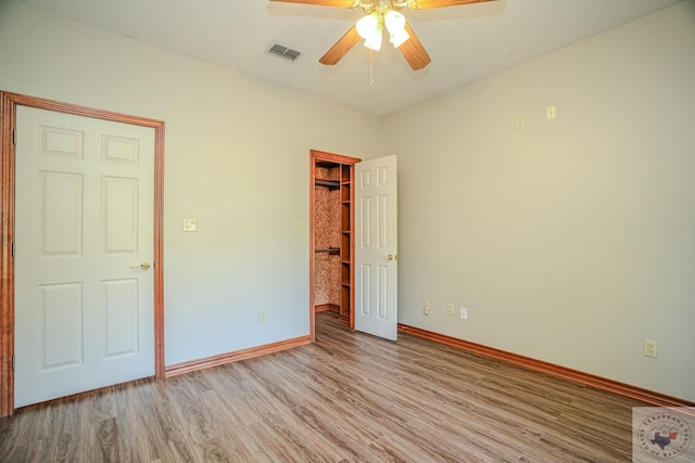 unfurnished bedroom featuring light wood-type flooring and ceiling fan