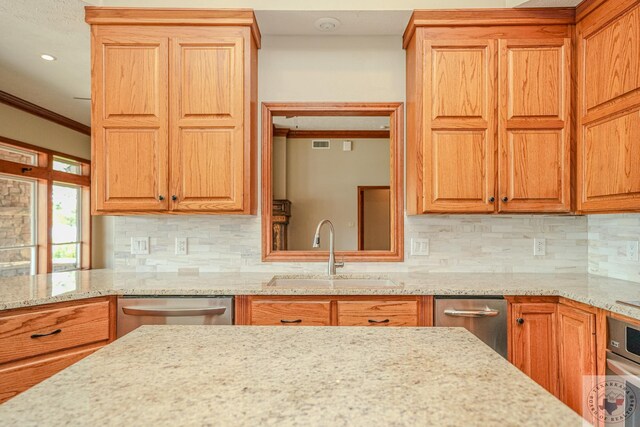 676 Akin Rd, Texarkana, TX 75503 - kitchen with sink, crown molding, decorative backsplash, and appliances with stainless steel finishes