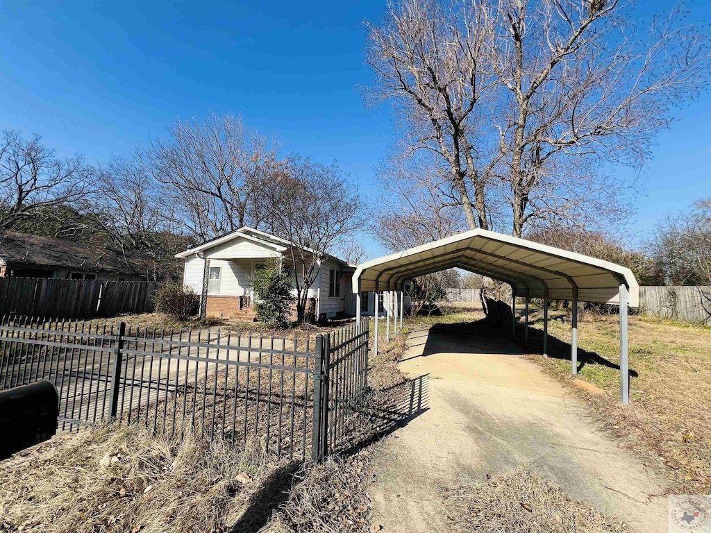 view of front of property featuring a carport