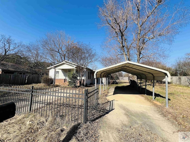 view of front of property featuring a carport