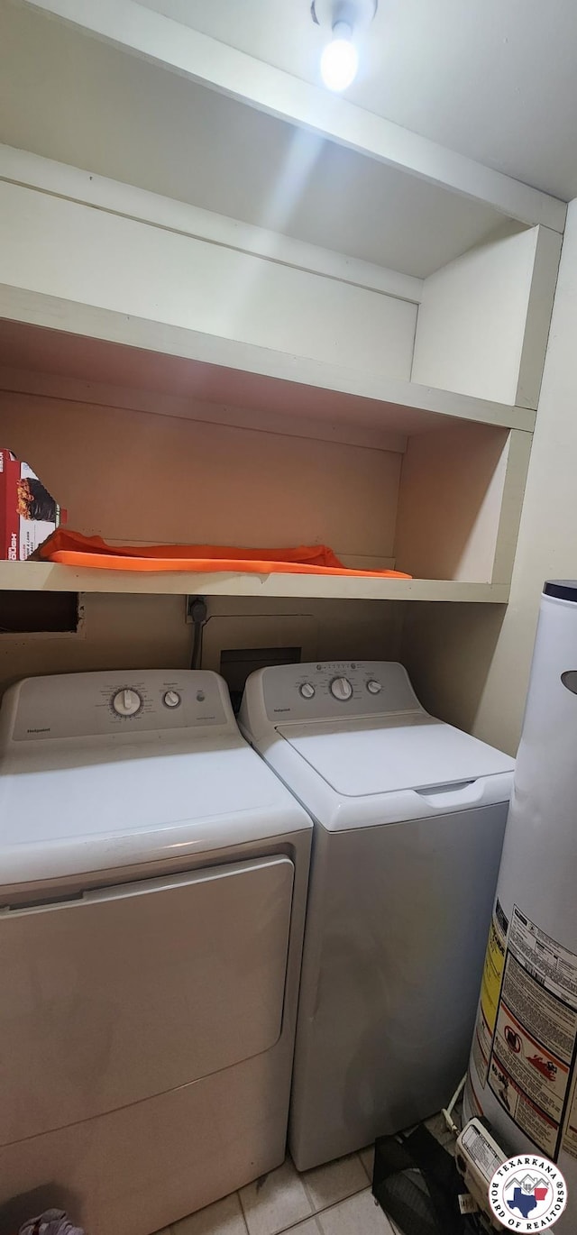 3507 Belmont Ave, Texarkana, AR 71854 - laundry area featuring gas water heater, washing machine and clothes dryer, and light tile patterned floors