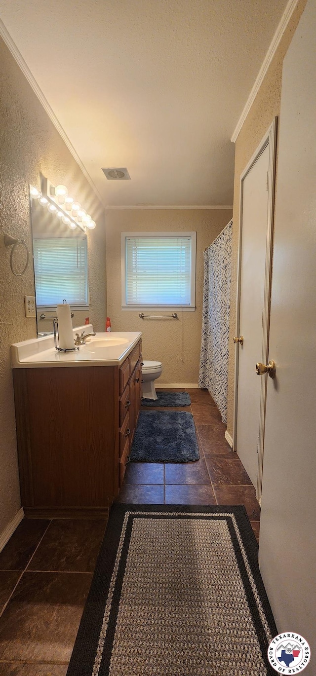 3507 Belmont Ave, Texarkana, AR 71854 - full bathroom with ornamental molding, double vanity, and a textured wall