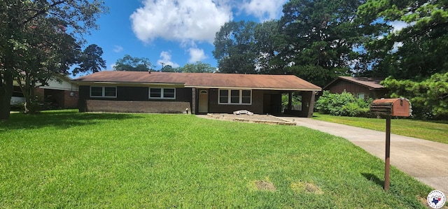 3507 Belmont Ave, Texarkana, AR 71854 - single story home with driveway, a front yard, an attached carport, and brick siding