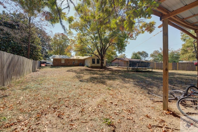 view of yard with a trampoline