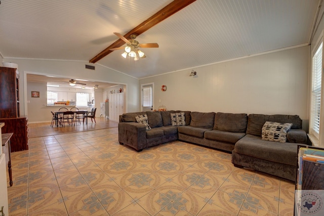 tiled living room featuring lofted ceiling with beams, ceiling fan, and ornamental molding