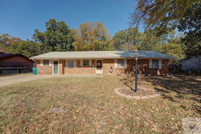 ranch-style house with a front lawn