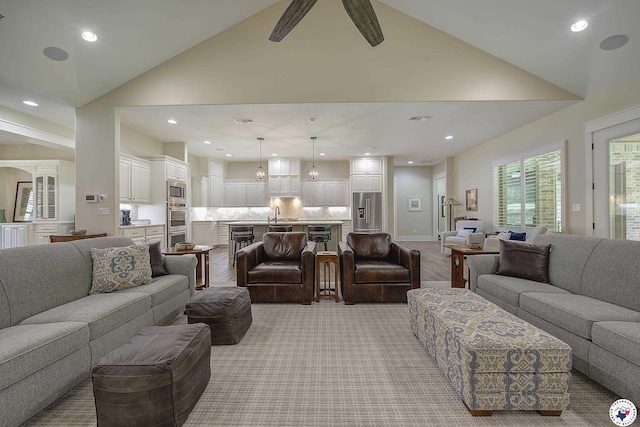 8907 River Ridge Drive, Texarkana, TX 75503 - living area with high vaulted ceiling, recessed lighting, ceiling fan, light wood-style floors, and baseboards