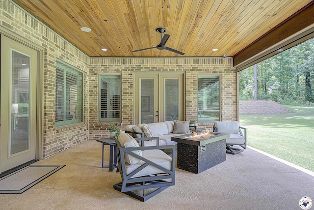 8907 River Ridge Drive, Texarkana, TX 75503 - view of patio / terrace featuring an outdoor fire pit, ceiling fan, and french doors
