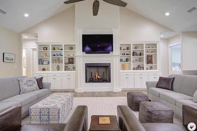 8907 River Ridge Drive, Texarkana, TX 75503 - living area featuring high vaulted ceiling, a lit fireplace, light wood-style flooring, ceiling fan, and recessed lighting