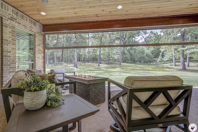 8907 River Ridge Drive, Texarkana, TX 75503 - sunroom / solarium with an outdoor fire pit and view of scattered trees
