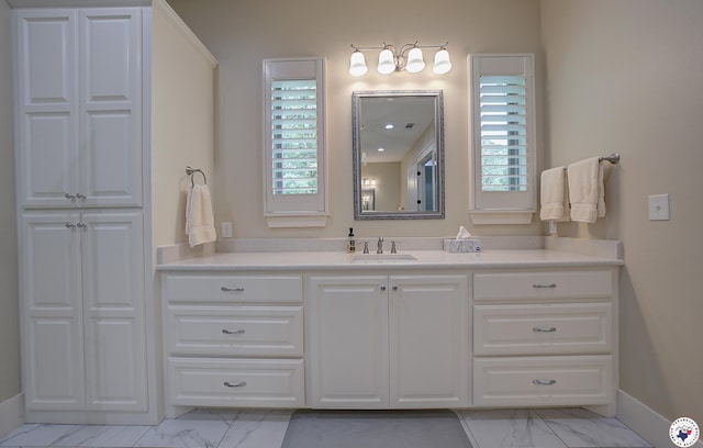 8907 River Ridge Drive, Texarkana, TX 75503 - bathroom with marble finish floors, vanity, and baseboards