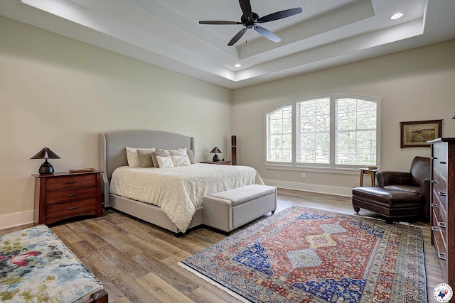 8907 River Ridge Drive, Texarkana, TX 75503 - bedroom featuring a raised ceiling, baseboards, wood finished floors, recessed lighting, and a ceiling fan