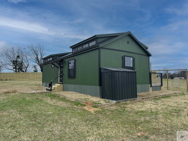 view of outbuilding with a lawn