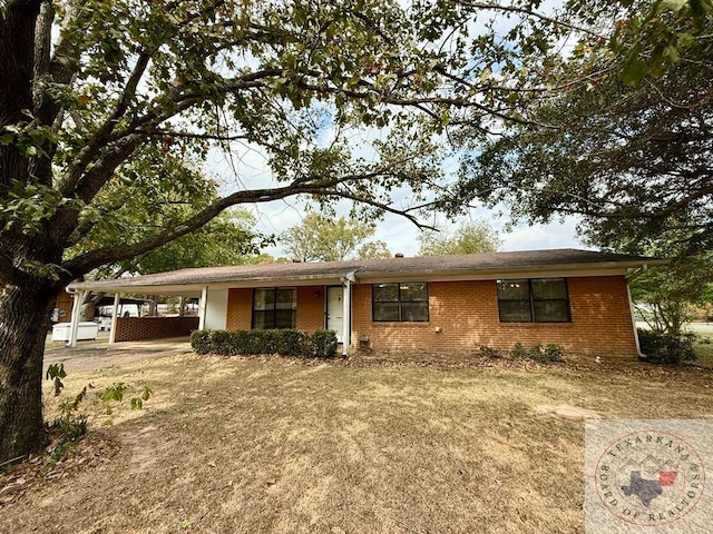 ranch-style home with a carport