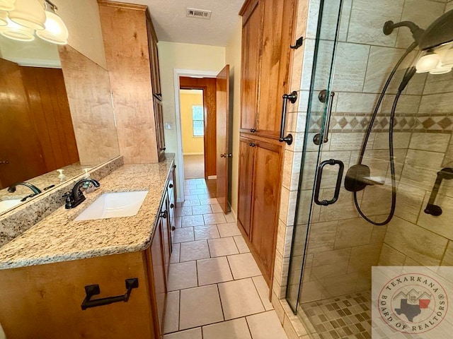 bathroom with wood walls, a shower with shower door, and vanity