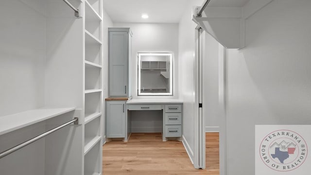 spacious closet featuring light wood finished floors