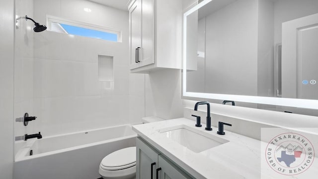 bathroom featuring toilet, washtub / shower combination, and vanity