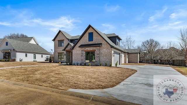 view of front of home featuring concrete driveway, brick siding, an attached garage, and stone siding