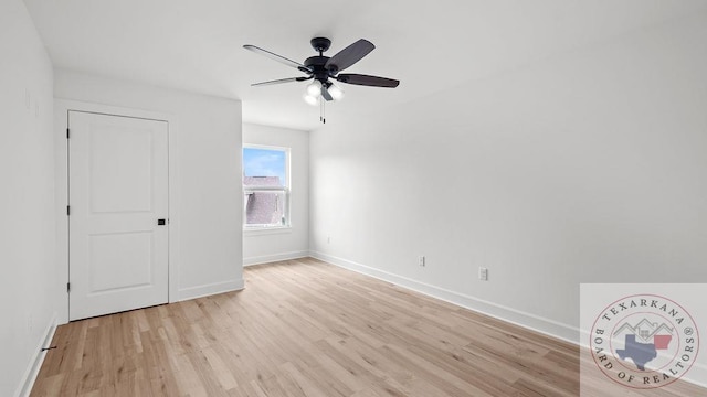 unfurnished bedroom with light wood-type flooring, ceiling fan, and baseboards