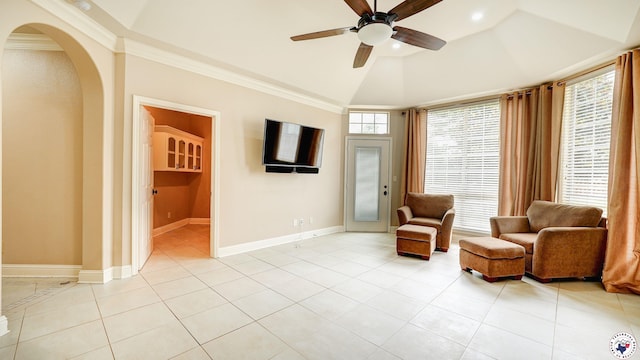 1067 Beaver Lake Dr, Texarkana, TX 75501 - sitting room with a ceiling fan, vaulted ceiling, light tile patterned floors, arched walkways, and ornamental molding