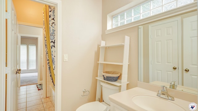 1067 Beaver Lake Dr, Texarkana, TX 75501 - bathroom with vanity, plenty of natural light, tile patterned floors, and toilet