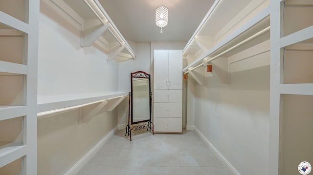 1067 Beaver Lake Dr, Texarkana, TX 75501 - walk in closet with light tile patterned floors