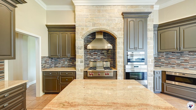 1067 Beaver Lake Dr, Texarkana, TX 75501 - kitchen with light tile patterned flooring, appliances with stainless steel finishes, ornamental molding, tasteful backsplash, and light stone counters