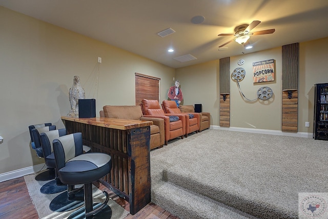 home theater featuring ceiling fan and wood-type flooring