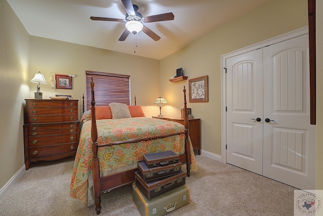 carpeted bedroom featuring a closet and ceiling fan