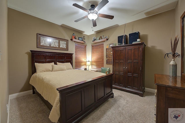 bedroom featuring ceiling fan and light colored carpet