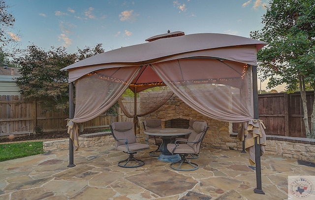 patio terrace at dusk with a gazebo