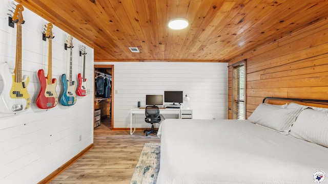 77 Big Rock Cir, Texarkana, AR 71854 - bedroom with wood ceiling, baseboards, an office area, light wood-style flooring, and wood walls