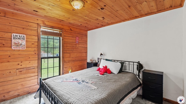 77 Big Rock Cir, Texarkana, AR 71854 - carpeted bedroom with wooden ceiling and wood walls