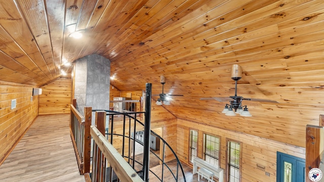 77 Big Rock Cir, Texarkana, AR 71854 - hallway with an upstairs landing, wood walls, vaulted ceiling, wooden ceiling, and wood finished floors