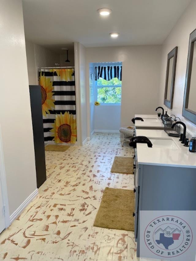 bathroom with vanity and a shower with shower curtain