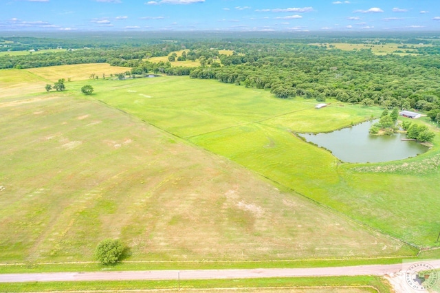 aerial view with a water view and a rural view