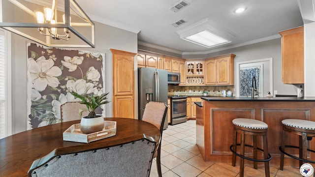 13 Whitney Cir, Texarkana, TX 75503 - kitchen featuring appliances with stainless steel finishes, a chandelier, light tile patterned floors, decorative backsplash, and glass insert cabinets