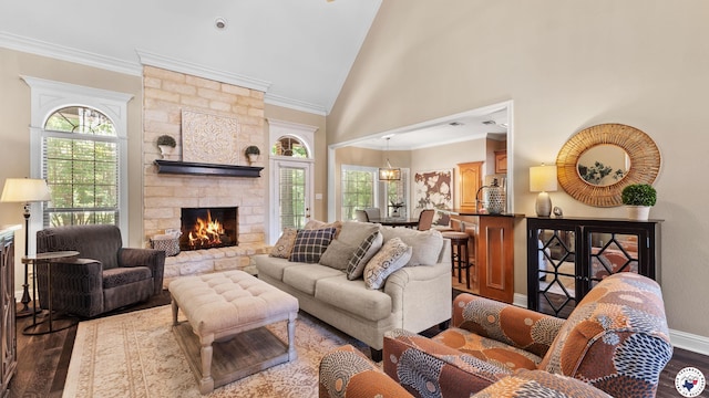 13 Whitney Cir, Texarkana, TX 75503 - living area featuring dark wood-style floors, plenty of natural light, a fireplace, high vaulted ceiling, and ornamental molding