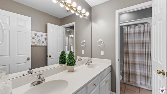 13 Whitney Cir, Texarkana, TX 75503 - bathroom with double vanity, tile patterned floors, and shower / tub combo