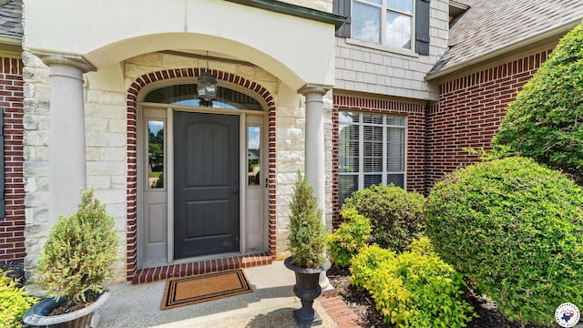 13 Whitney Cir, Texarkana, TX 75503 - doorway to property featuring brick siding and a shingled roof