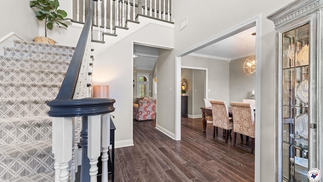13 Whitney Cir, Texarkana, TX 75503 - foyer with crown molding, wood finished floors, a chandelier, and stairs