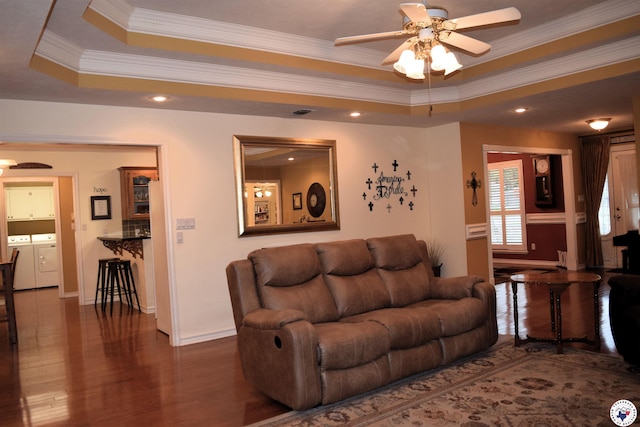 6002 Forest Bnd, Texarkana, AR 71854 - living area with independent washer and dryer, ceiling fan, wood finished floors, a tray ceiling, and crown molding