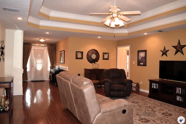 6002 Forest Bnd, Texarkana, AR 71854 - living room featuring a tray ceiling, a ceiling fan, dark wood-style flooring, ornamental molding, and recessed lighting