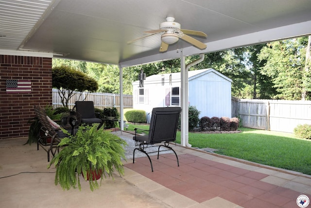 6002 Forest Bnd, Texarkana, AR 71854 - fenced backyard featuring a ceiling fan, a patio area, and a shed